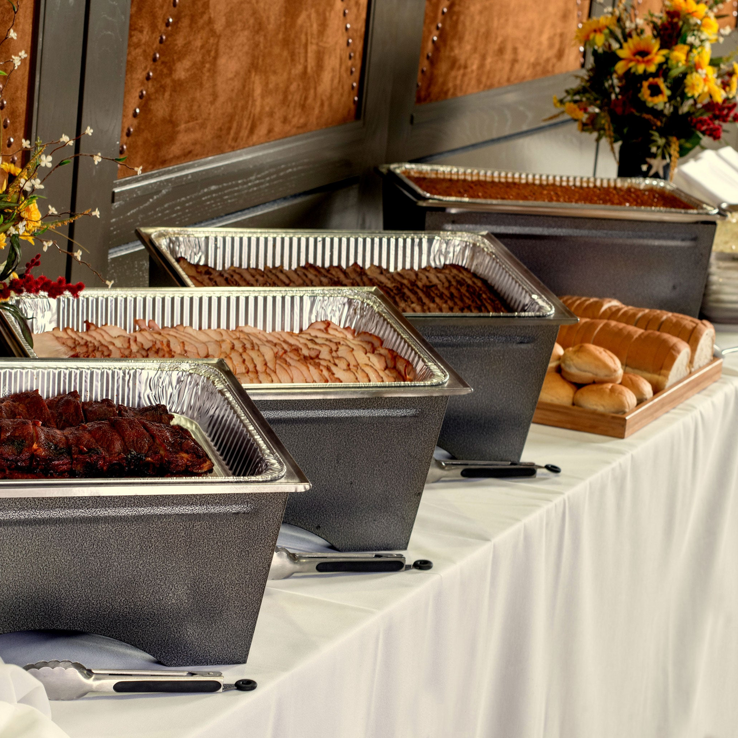 Joe's KC Catering pans of food at event